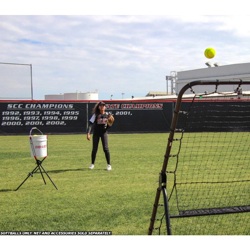 Powernet Practice Softballs 12 PK Recreation Grade in a field 