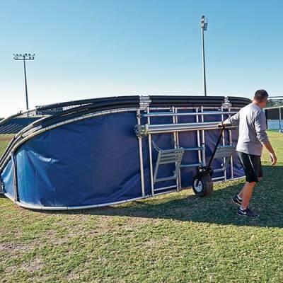 big bubba elite backstop being taken off field with portable wheels