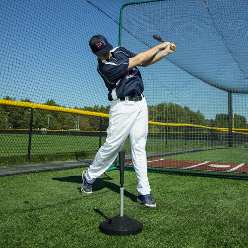man hitting promounds pvtee batting tee